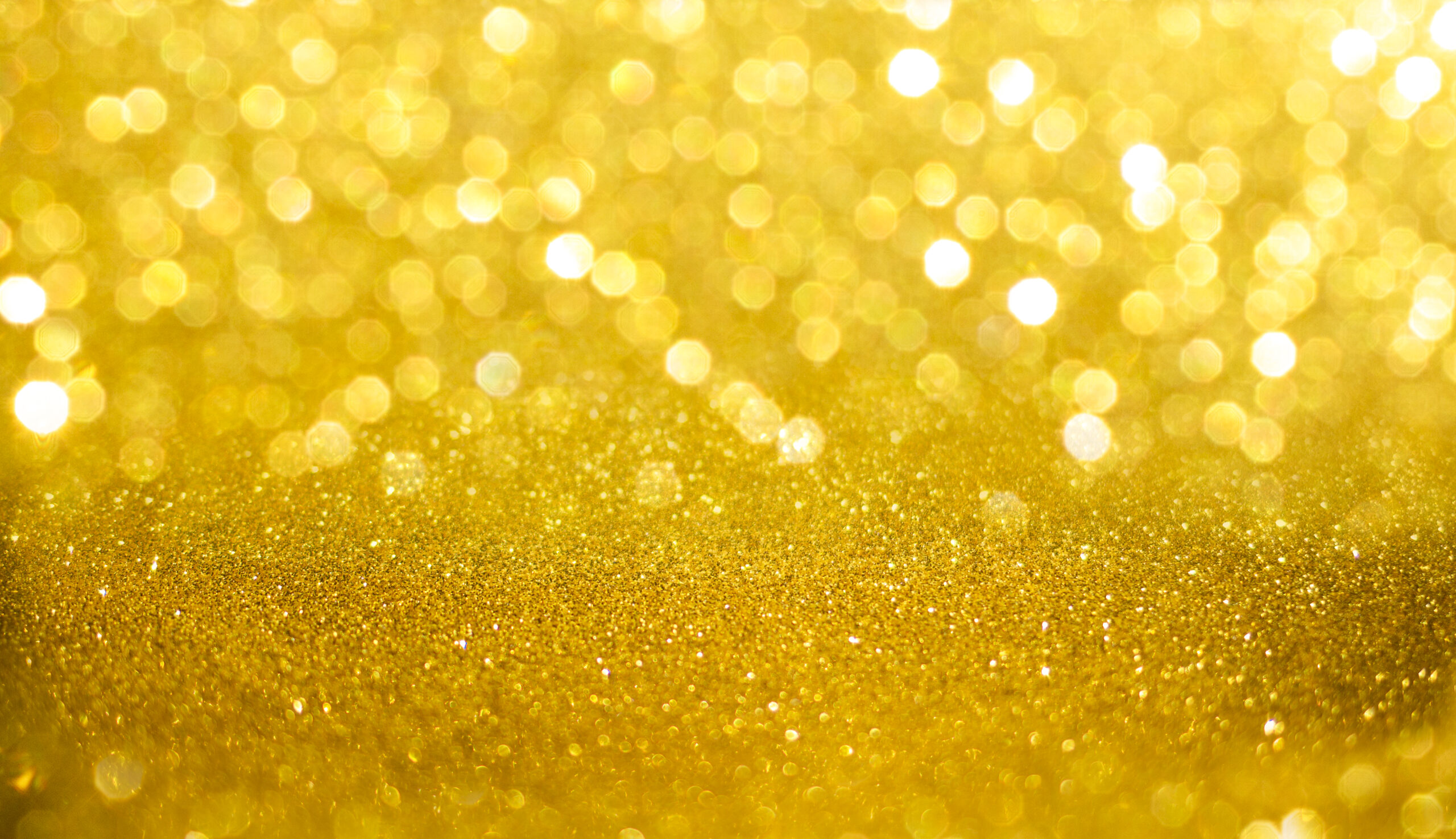 Yellow, shiny background with focus and bokeh Charity Night Genolier Foundation : une soirée d'exception pour vaincre le cancer